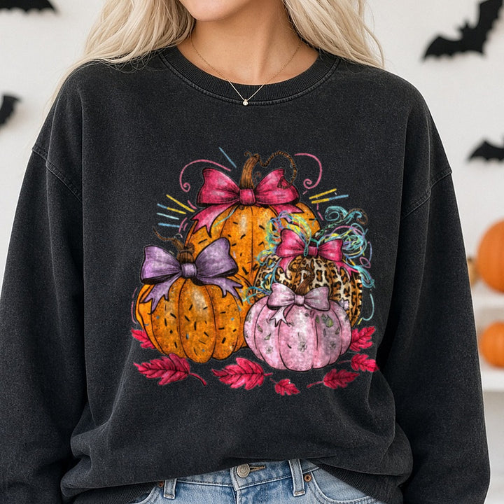 Halloween Fall Pumpkin Bright Leopard Bows Confetti DTF transfer shown on a Comfort Colors sweatshirt