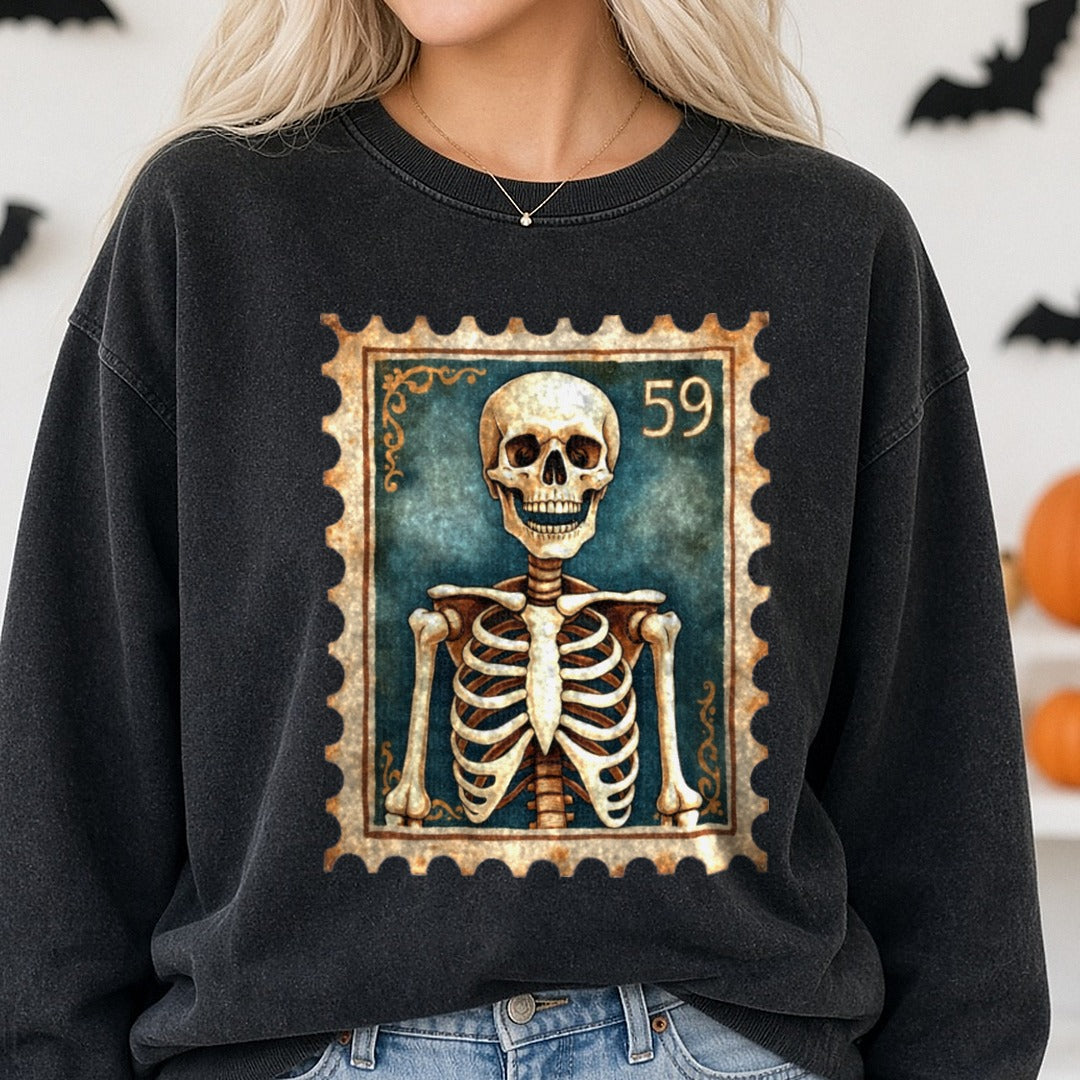 Halloween Fall Spooky Skeleton Stamp DTF transfer shown on a Comfort Colors sweatshirt
