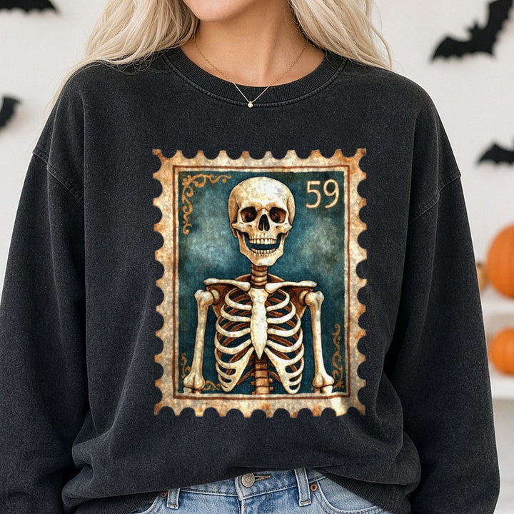 Halloween Fall Spooky Skeleton Stamp DTF transfer shown on a Comfort Colors sweatshirt