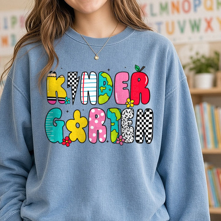 Back to School Teacher Kinder DTF transfer shown on a Comfort Colors sweatshirt