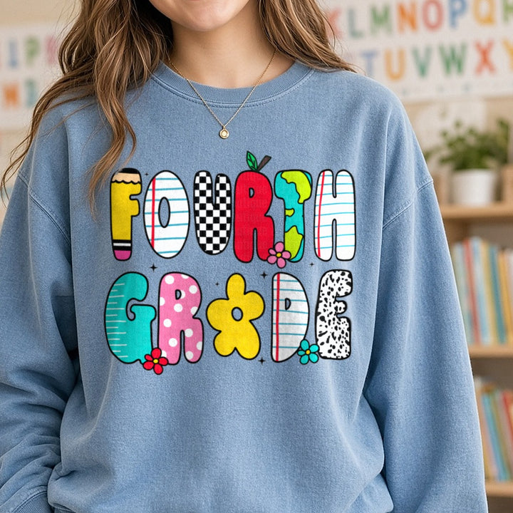 Back to School Teacher 4th Doodles DTF transfer shown on a Comfort Colors sweatshirt