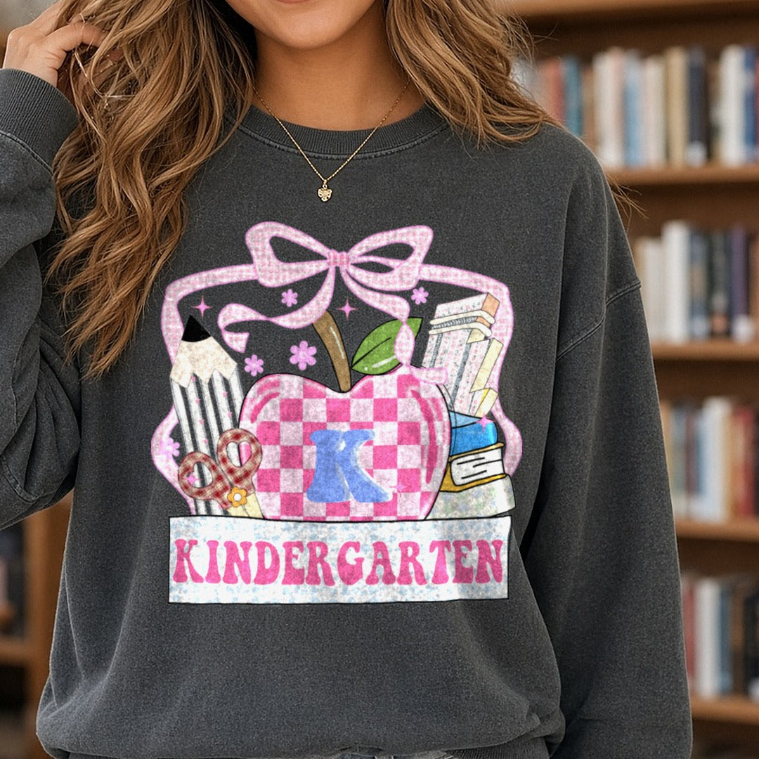 Back To School Teacher Kindergarten Checkered Apple Pencil DTF transfer shown on a Comfort Colors sweatshirt