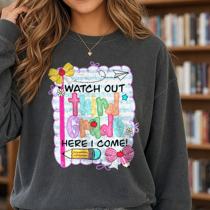 Back to School Teacher Watch Out Here I Come Third Grade DTF transfer shown on a Comfort Colors sweatshirt