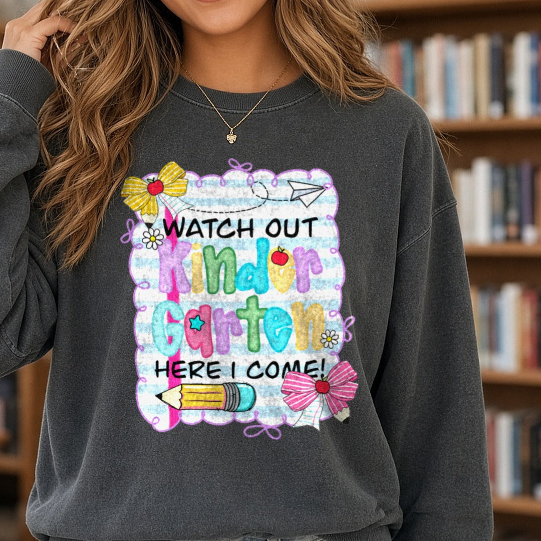 Back to School Teacher Watch Out Here I Come Kindergarten DTF transfer shown on a Comfort Colors sweatshirt