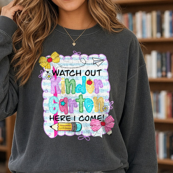 Back to School Teacher Watch Out Here I Come Kindergarten DTF transfer shown on a Comfort Colors sweatshirt