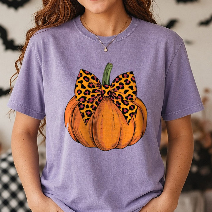Halloween Fall Pumpkin Leopard Coquette Bow Bright Orange DTF transfer shown on a Comfort Colors tee