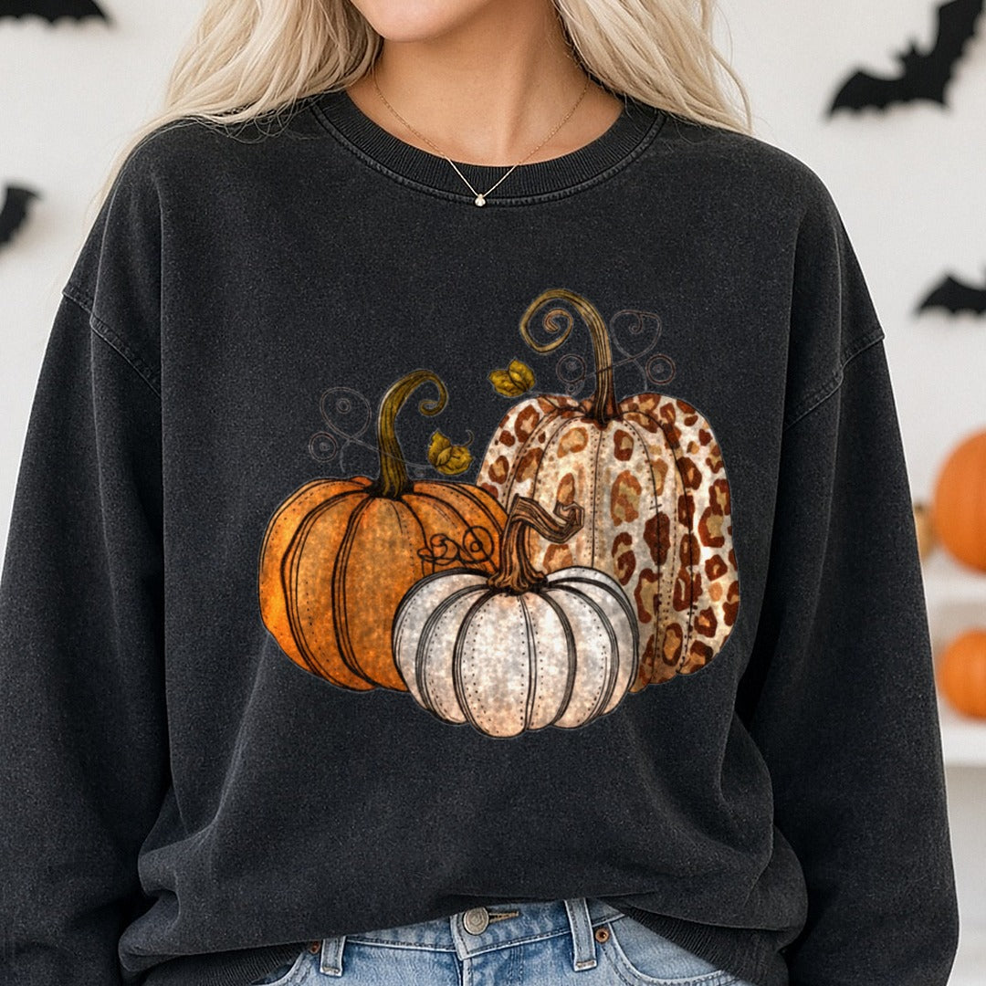 Halloween Fall Pumpkin Trio Orange Leopard Swirl Vines DTF transfer shown on a Comfort Colors sweatshirt