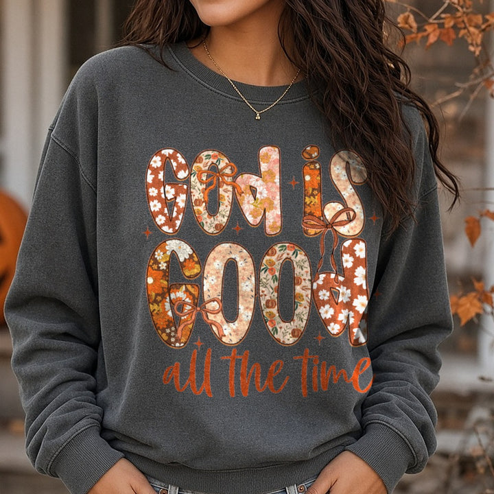 Halloween Fall God Is Good All The Time Floral Letters Bow DTF transfer shown on a Comfort Colors sweatshirt