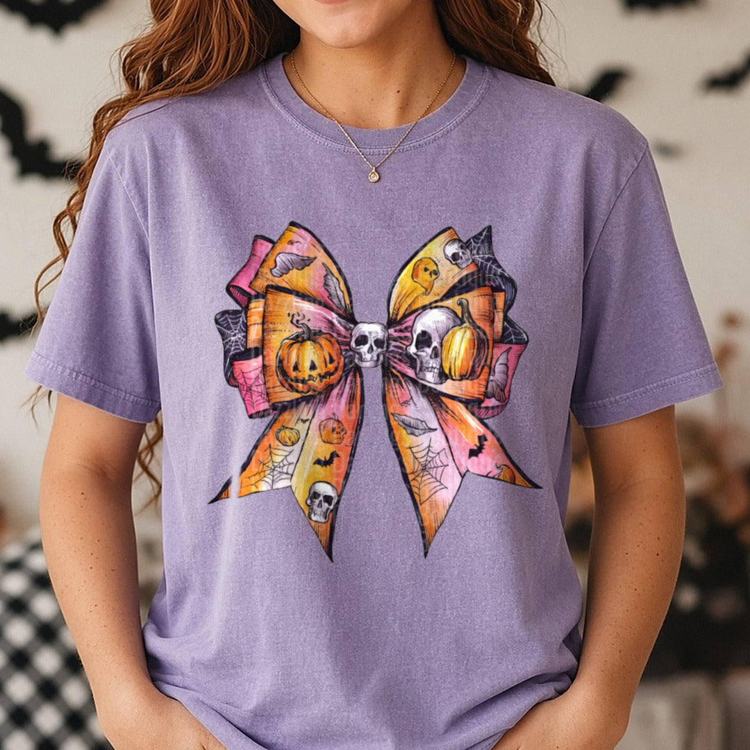Halloween Fall Coquette Bow Orange Pink Ombre Skulls DTF transfer shown on a Comfort Colors tee