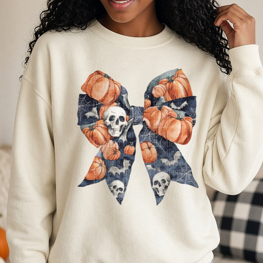 Halloween Fall Coquette Bow Dark Gray Pumpkins Bats Skull DTF transfer shown on a Comfort Colors sweatshirt