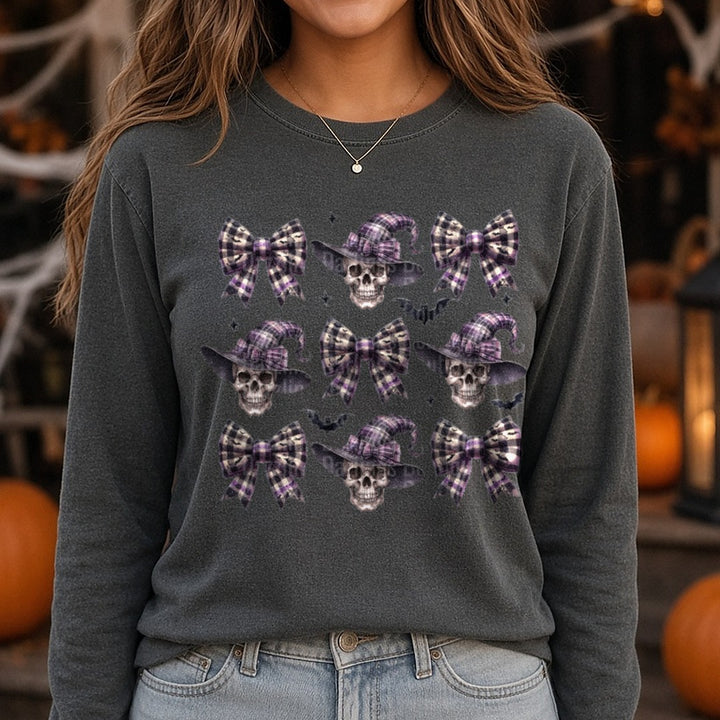 Halloween Fall Witch Skull and Coquette Bow DTF transfer shown on a Comfort Colors long sleeve tee