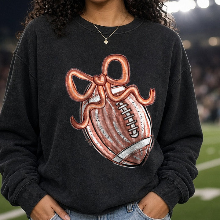 Coquette Football With Copper Bow DTF transfer shown on a Comfort Colors sweatshirt