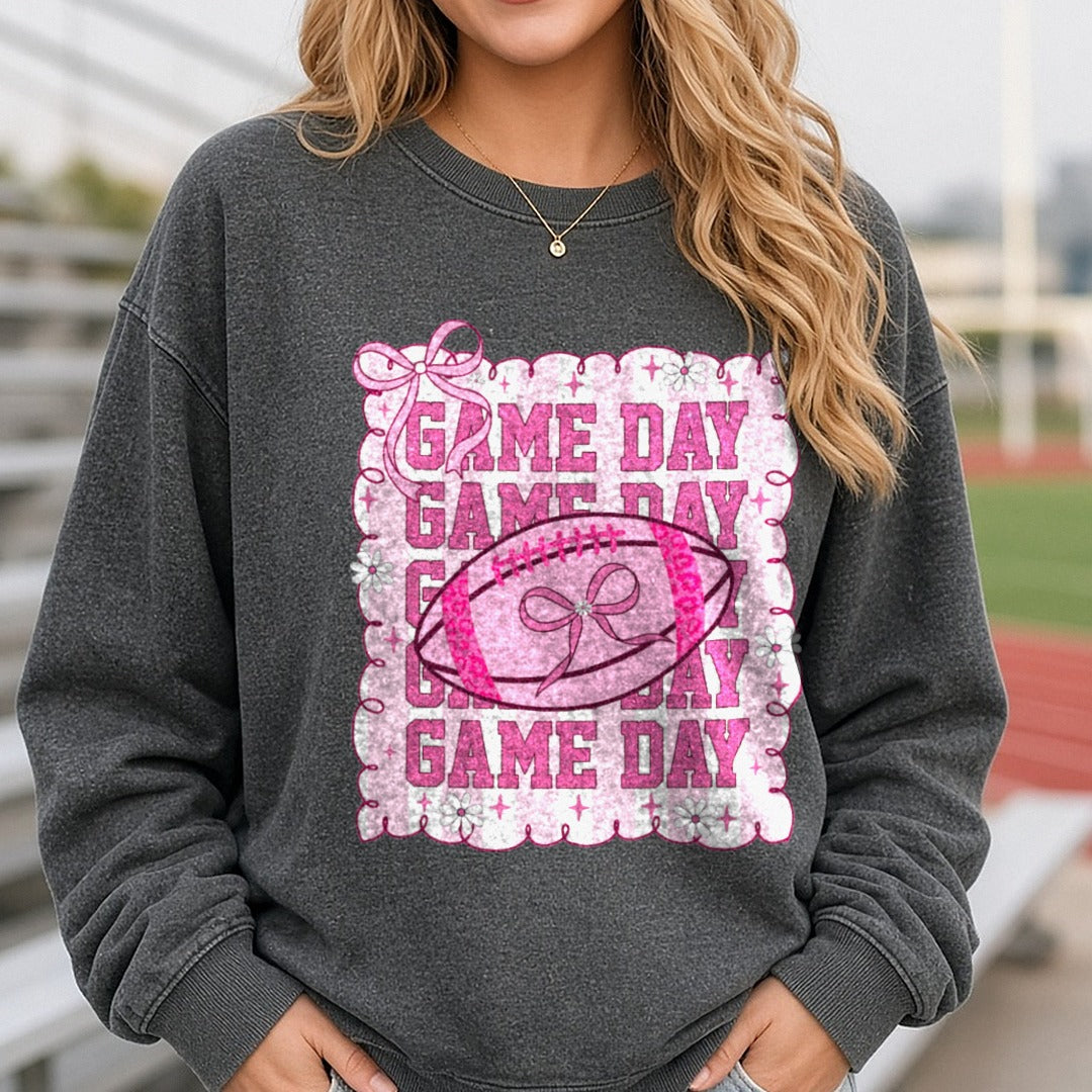 Game Day Pink Football Coquette Bow Repeat Text DTF transfer shown on a Comfort Colors sweatshirt