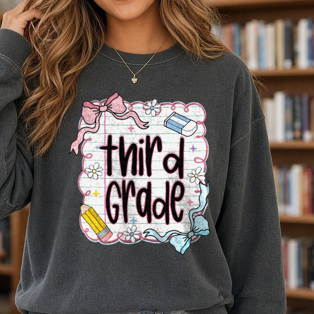 Third Grade Notebook Paper Pink Bow Pencil DTF transfer shown on a Comfort Colors sweatshirt