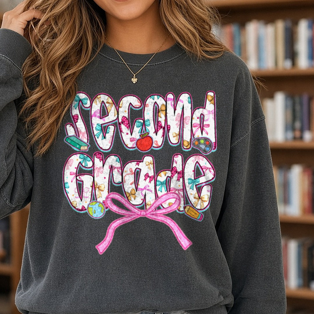 Second Grade Floral Letters Pink Bow Apple DTF transfer shown on a Comfort Colors sweatshirt