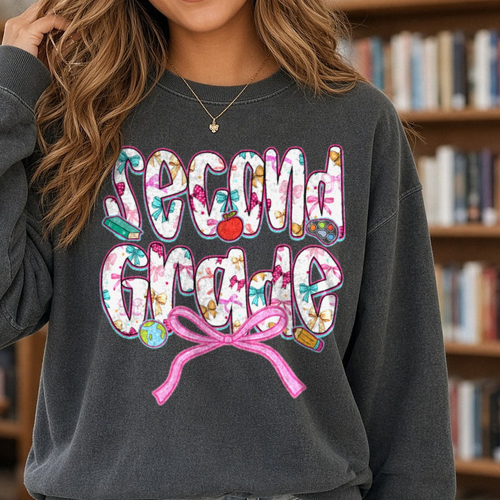 Second Grade Floral Letters Pink Bow Apple DTF transfer shown on a Comfort Colors sweatshirt