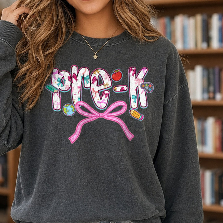Pre-K Floral Letters Pink Bow Apple DTF transfer shown on a Comfort Colors sweatshirt