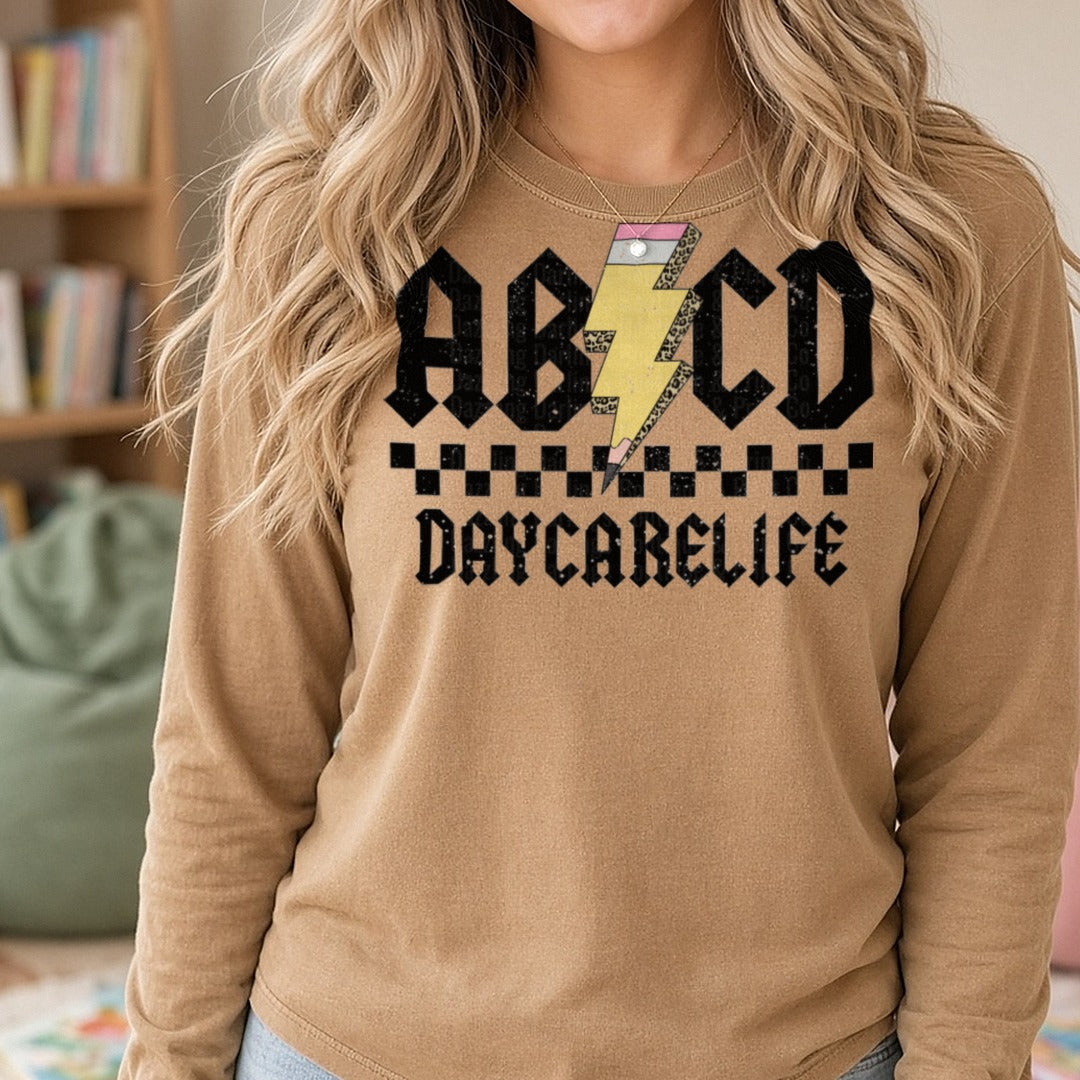 ABCD Daycarelife leopard DTF transfer shown on a Comfort Colors long sleeve tee