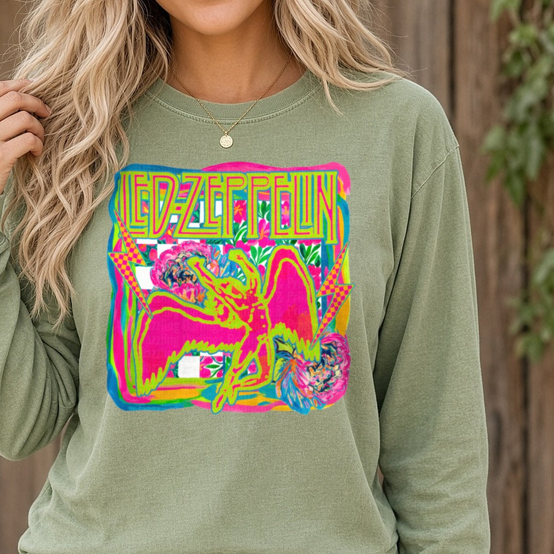 Rock Band Neon Winged Figure Gold Letters DTF transfer shown on a Comfort Colors long sleeve tee