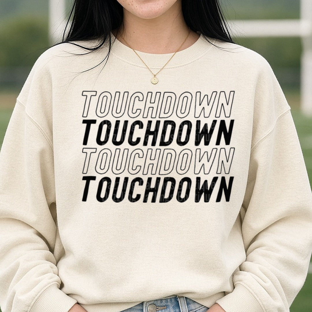 Football Touchdown Black Repeat Outline Italic DTF transfer shown on a Comfort Colors sweatshirt