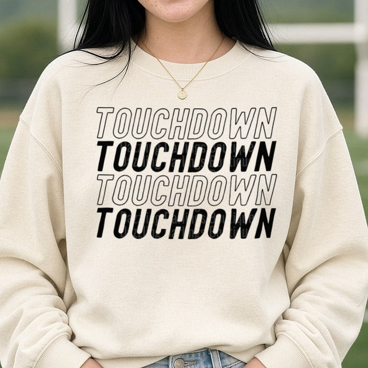 Football Touchdown Black Repeat Outline Italic DTF transfer shown on a Comfort Colors sweatshirt