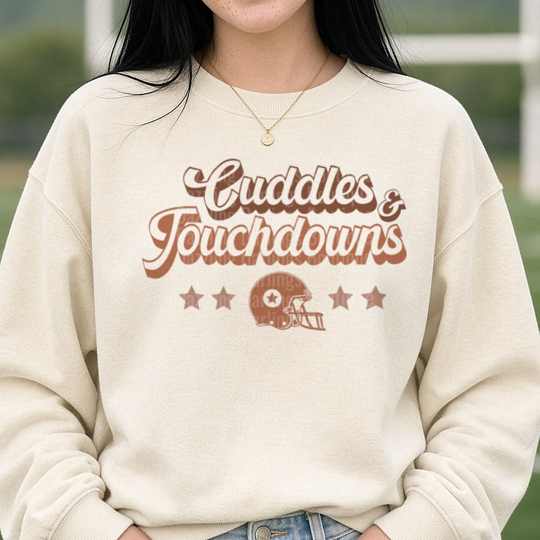 Football Cuddles and Touchdown Brown DTF transfer shown on a Comfort Colors sweatshirt