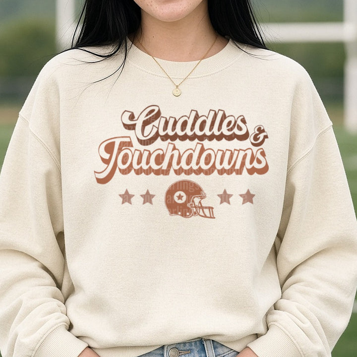 Football Cuddles and Touchdown Brown DTF transfer shown on a Comfort Colors sweatshirt