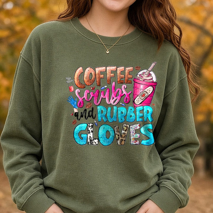 Nurse Coffee Scrubs and Rubber Gloves DTF transfer shown on a Comfort Colors sweatshirt