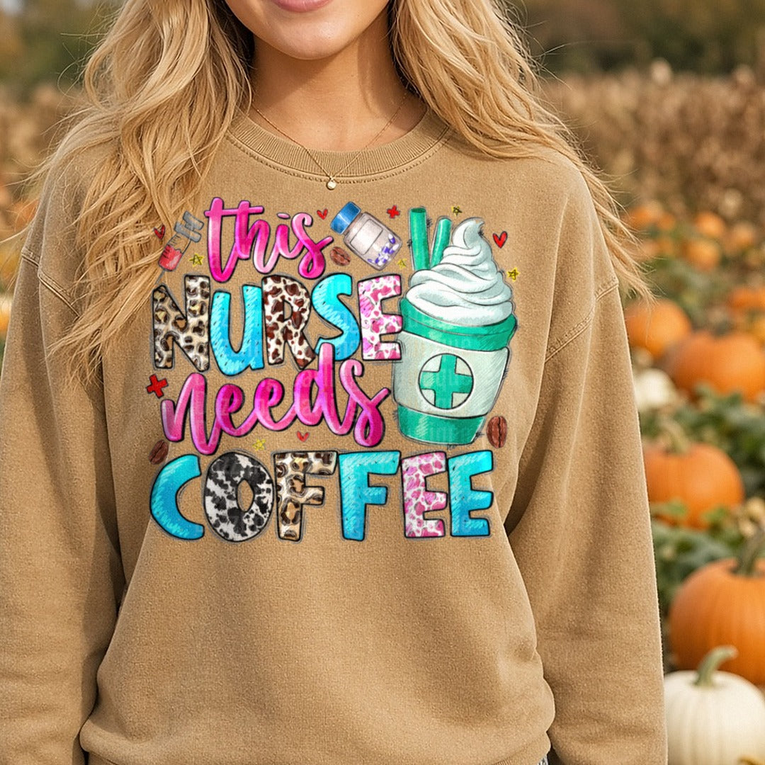 This Nurse Needs Coffee DTF transfer shown on a Comfort Colors sweatshirt