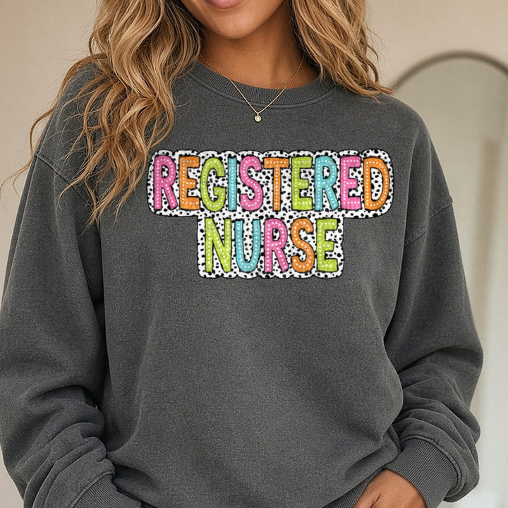 Registered Nurse Dalmatian Dots DTF transfer shown on a Comfort Colors sweatshirt
