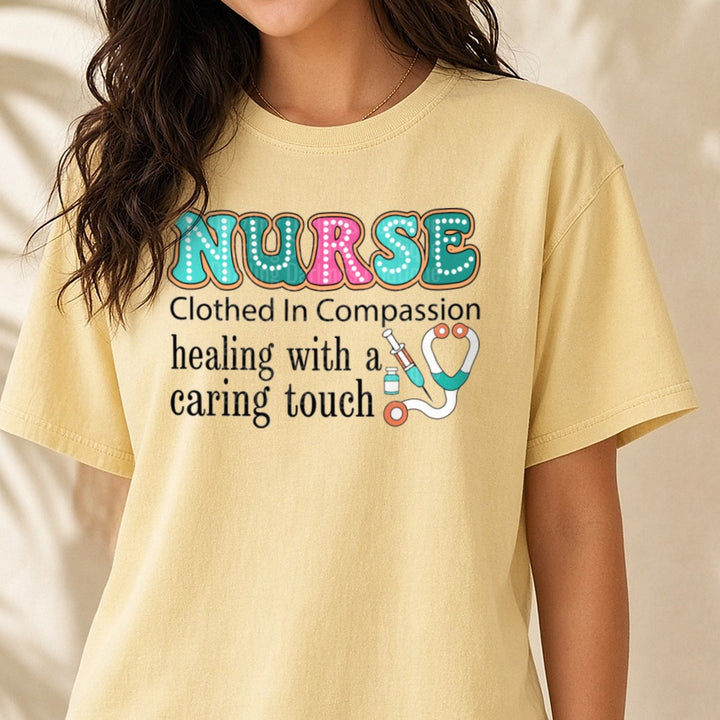 Nurse Clothed in Compassion Healing with a Caring Touch DTF transfer shown on a Comfort Colors tee