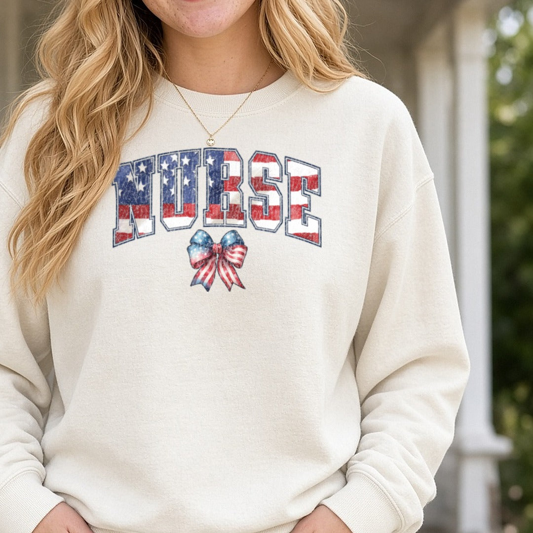Nurse Patriotic July 4th Distressed DTF transfer shown on a Comfort Colors sweatshirt