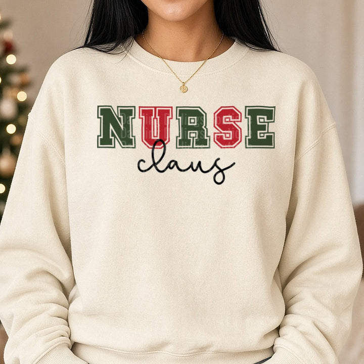 Nurse Claus Christmas Green Red Varsity Script DTF transfer shown on a Comfort Colors sweatshirt