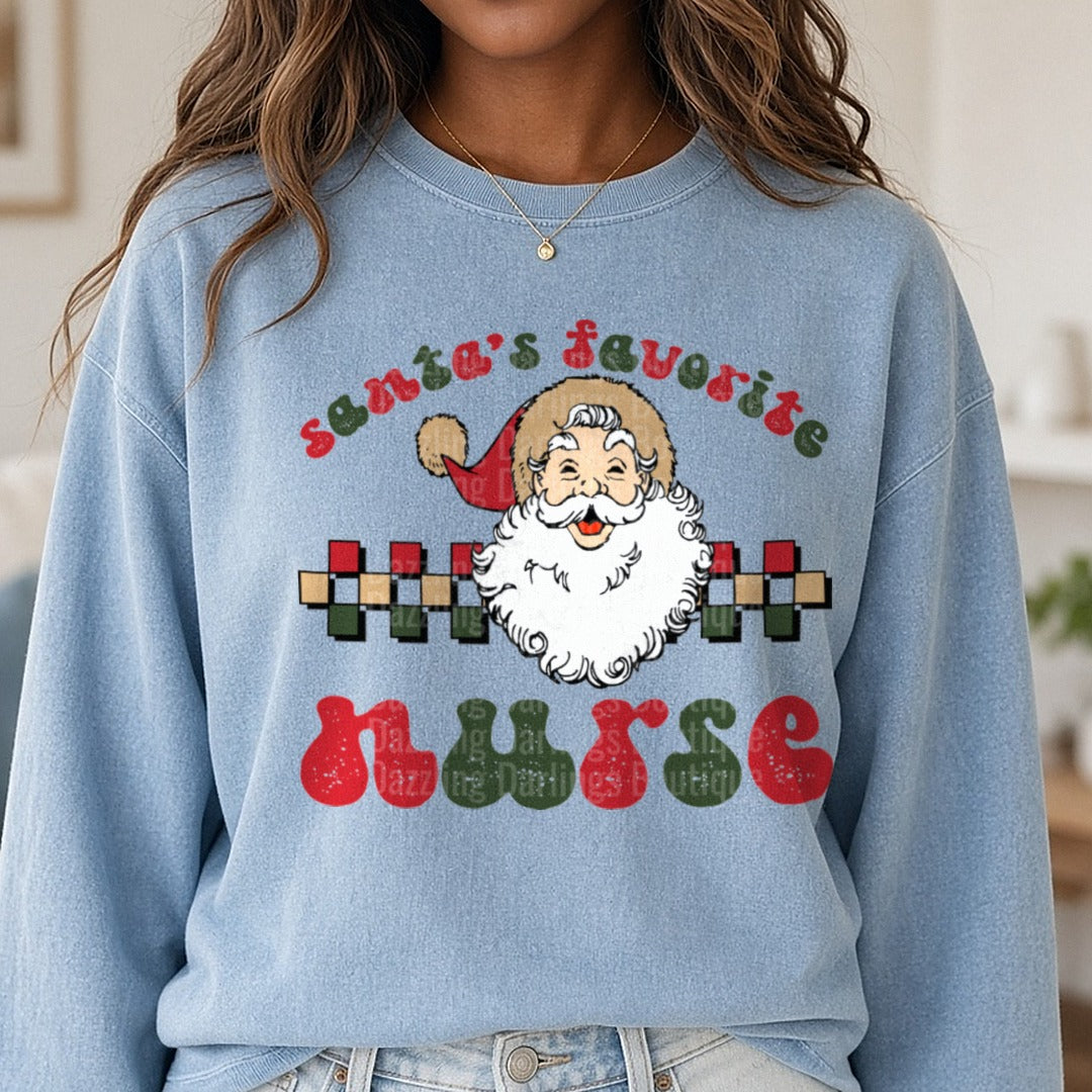 Santas Favorite Nurse DTF transfer shown on a Comfort Colors sweatshirt