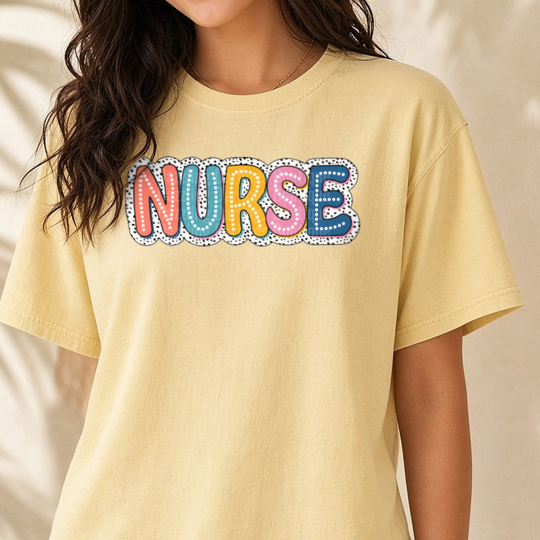 Nurse Bubble Letters Dalmation Spots DTF transfer shown on a Comfort Colors tee