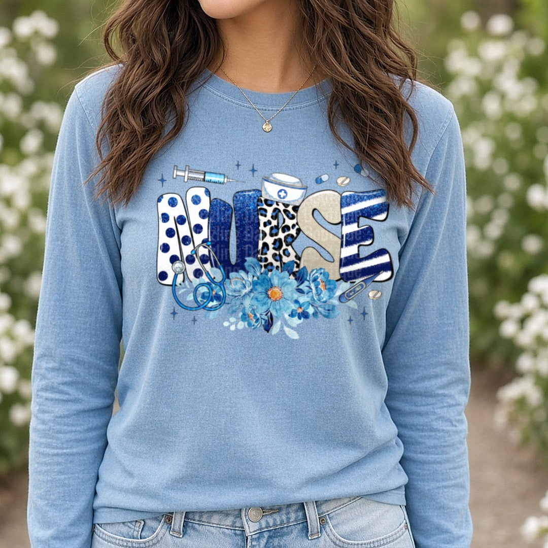 Nurse Blue Floral DTF transfer shown on a Comfort Colors long sleeve tee