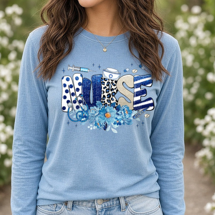 Nurse Blue Floral DTF transfer shown on a Comfort Colors long sleeve tee