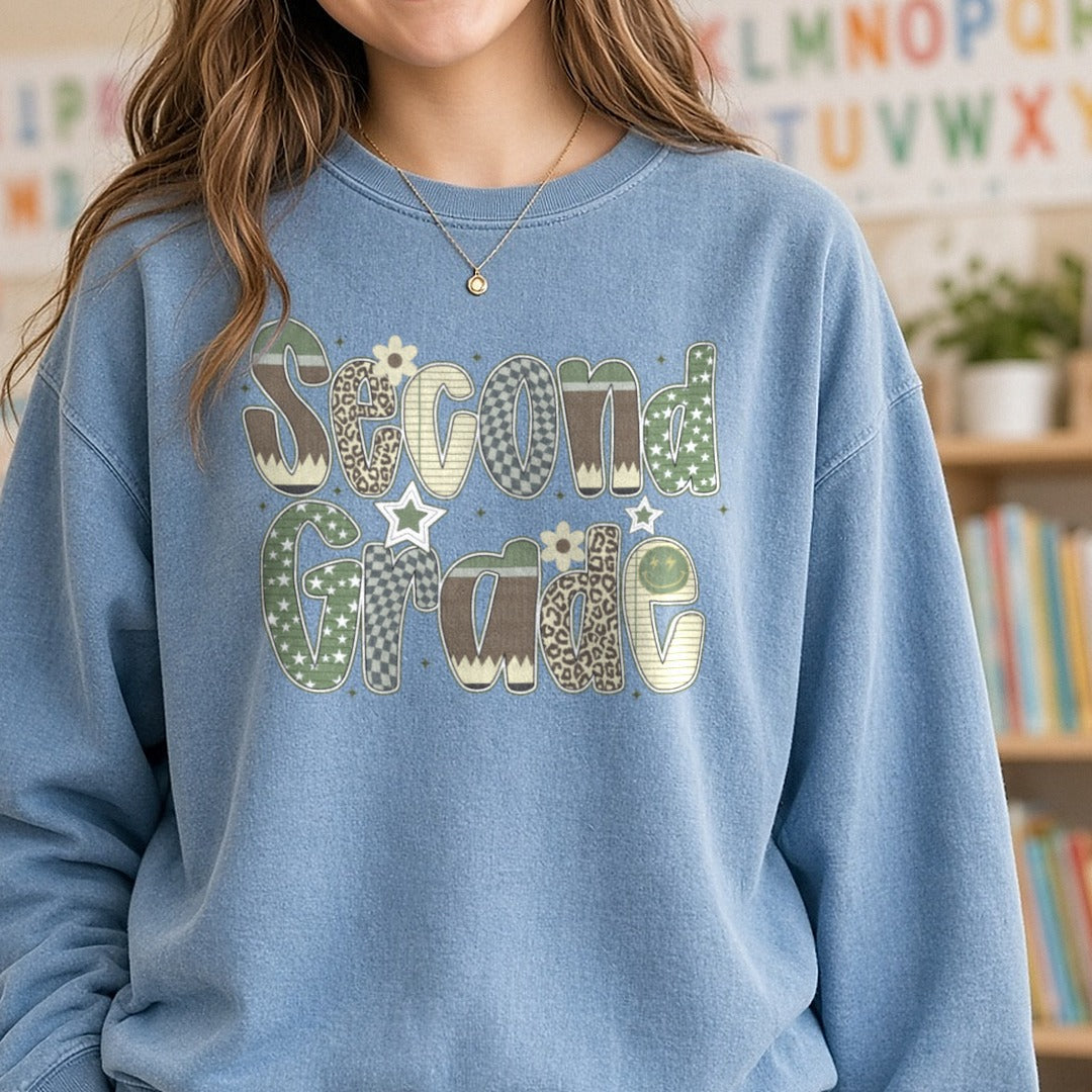 Second Grade Camo Patterned Letters Stars Leopard DTF transfer shown on a Comfort Colors sweatshirt