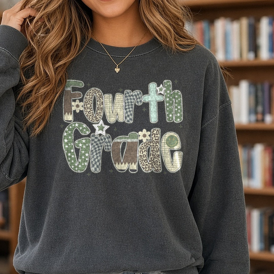Fourth Grade Camo Patterned Letters Stars Leopard DTF transfer shown on a Comfort Colors sweatshirt