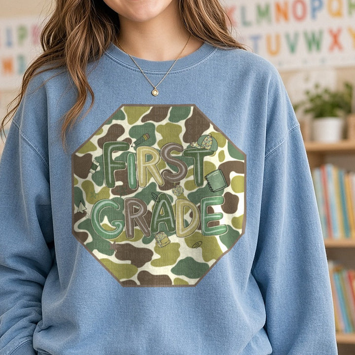 First Grade Camo Octagon Duck Camo Background DTF transfer shown on a Comfort Colors sweatshirt