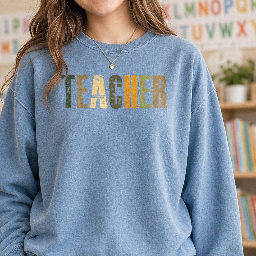 Teacher DTF transfer shown on a Comfort Colors sweatshirt