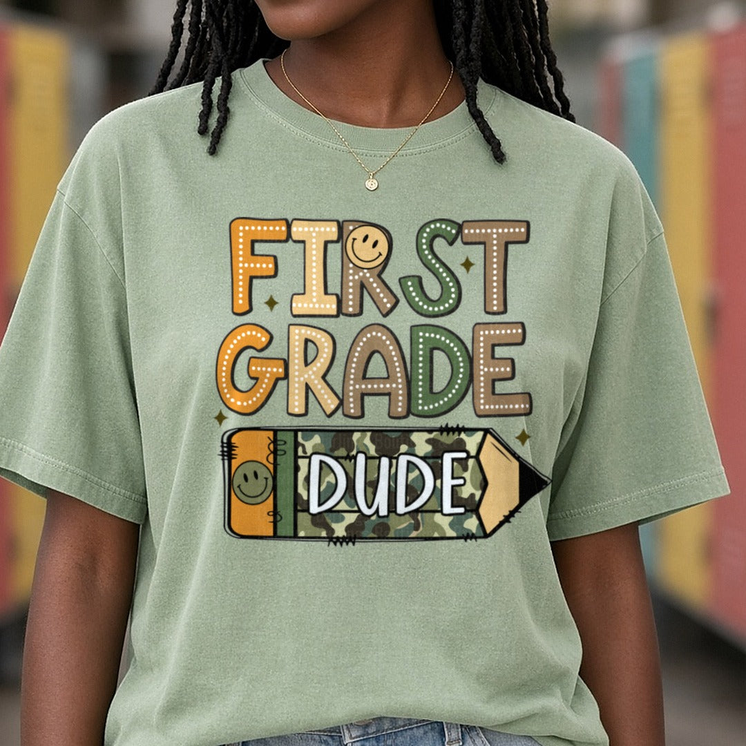 First Grade Dude Camo Pencil DTF transfer shown on a Comfort Colors tee