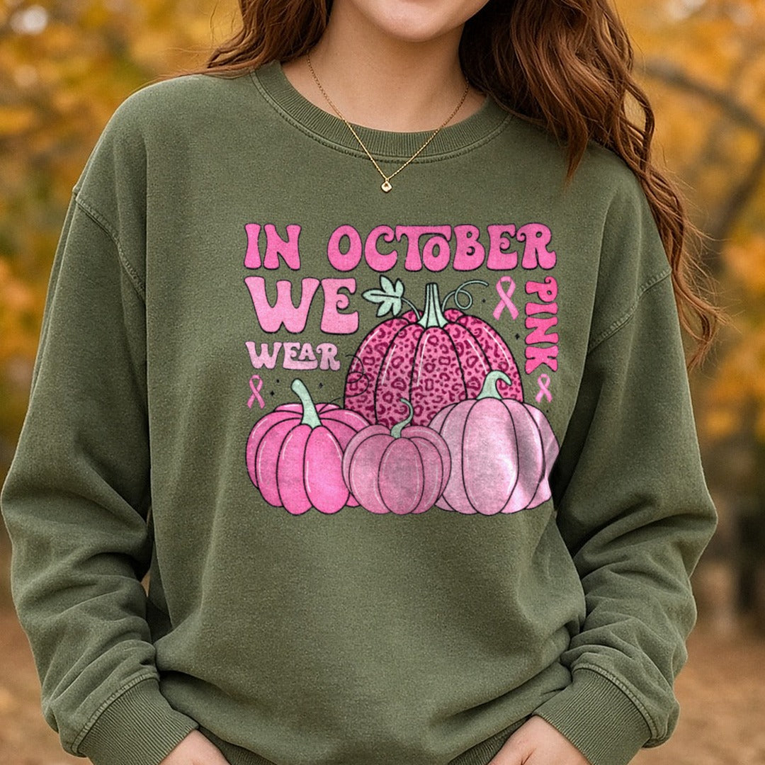 Breast Cancer Awareness in October We Wear Pink Distressed DTF transfer shown on a Comfort Colors sweatshirt