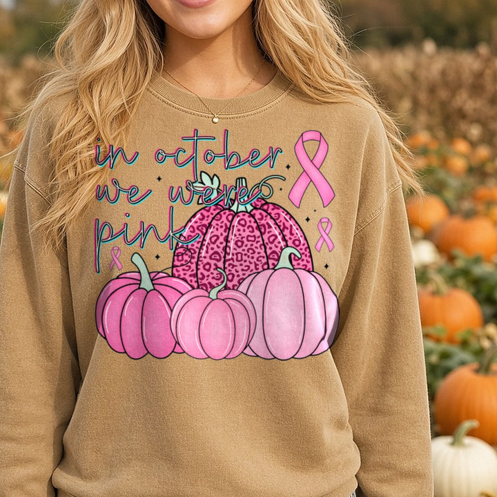 Breast Cancer Awareness in October We Wear Pink DTF transfer shown on a Comfort Colors sweatshirt