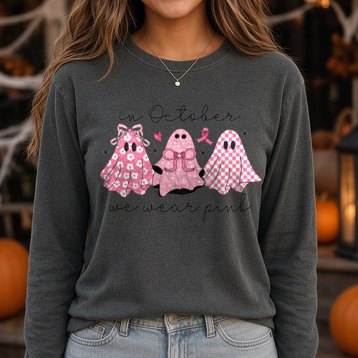 Breast Cancer Awareness In October We Wear Pink Ghost Trio Bows DTF transfer shown on a Comfort Colors long sleeve tee