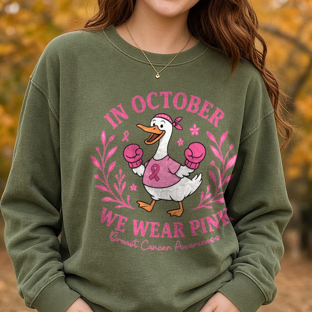 Breast Cancer Awareness in October We Wear Pink Goose DTF transfer shown on a Comfort Colors sweatshirt