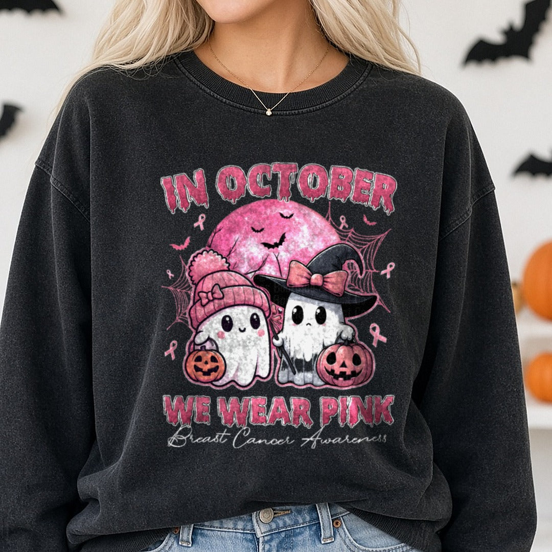 Breast Cancer Awareness Ribbon in October We Wear Pink Ghost DTF transfer shown on a Comfort Colors sweatshirt