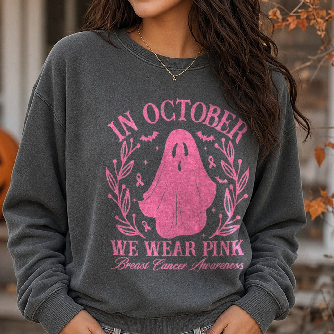 Breast Cancer Awareness Ribbon In October We Wear Pink Ghost Wreath DTF transfer shown on a Comfort Colors sweatshirt