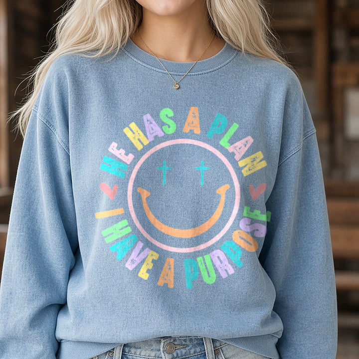 He Has a Plan I Have a Purpose Smiley DTF transfer shown on a Comfort Colors sweatshirt