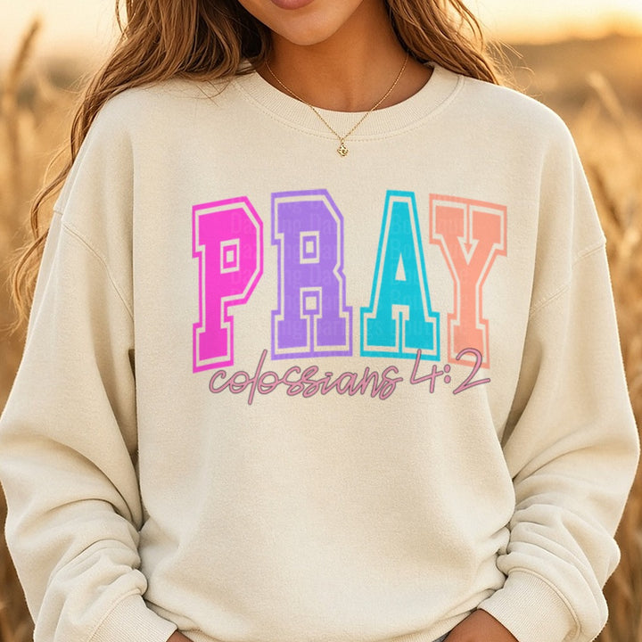 Pray DTF transfer shown on a Comfort Colors sweatshirt